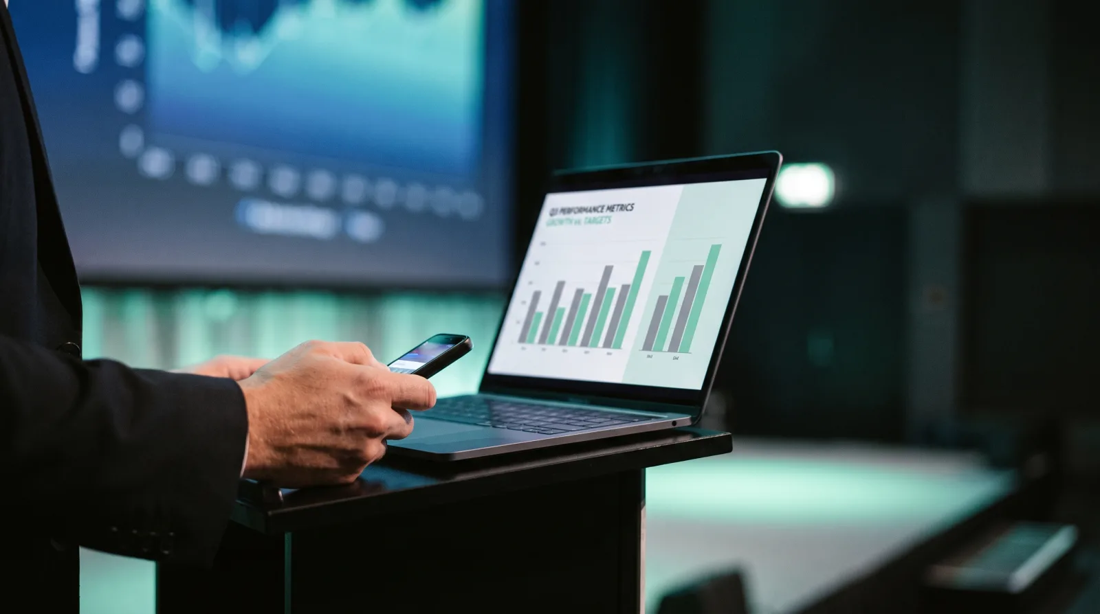 Cliqer PowerPoint clicker in use, a presenter advancing slides on a conference stage